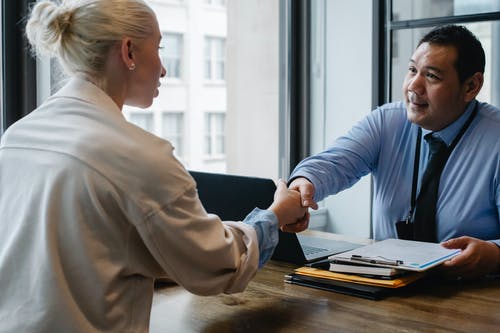 an ERP consultant shaking hands with a client